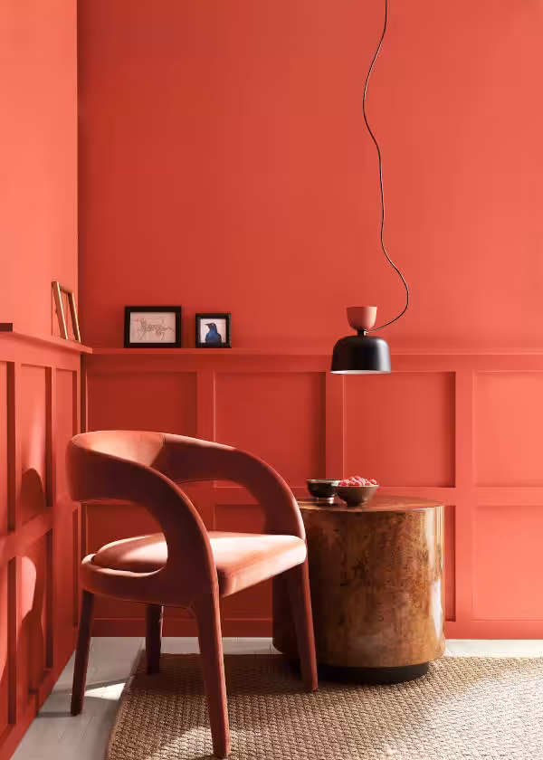 chair in corner of walls painted with raspberry blush