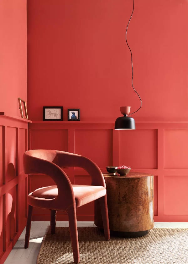 chair in corner of walls painted with raspberry blush