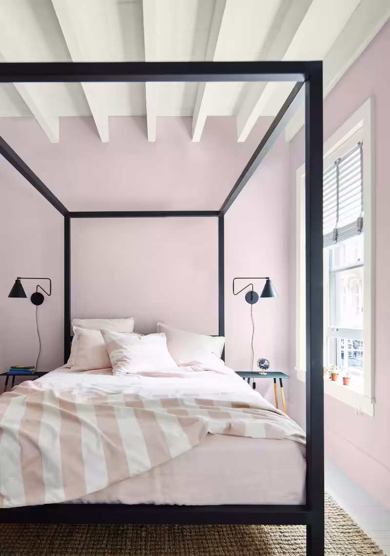 bedroom painted with Benjamin Moore New Age colour and a black metallic bed
