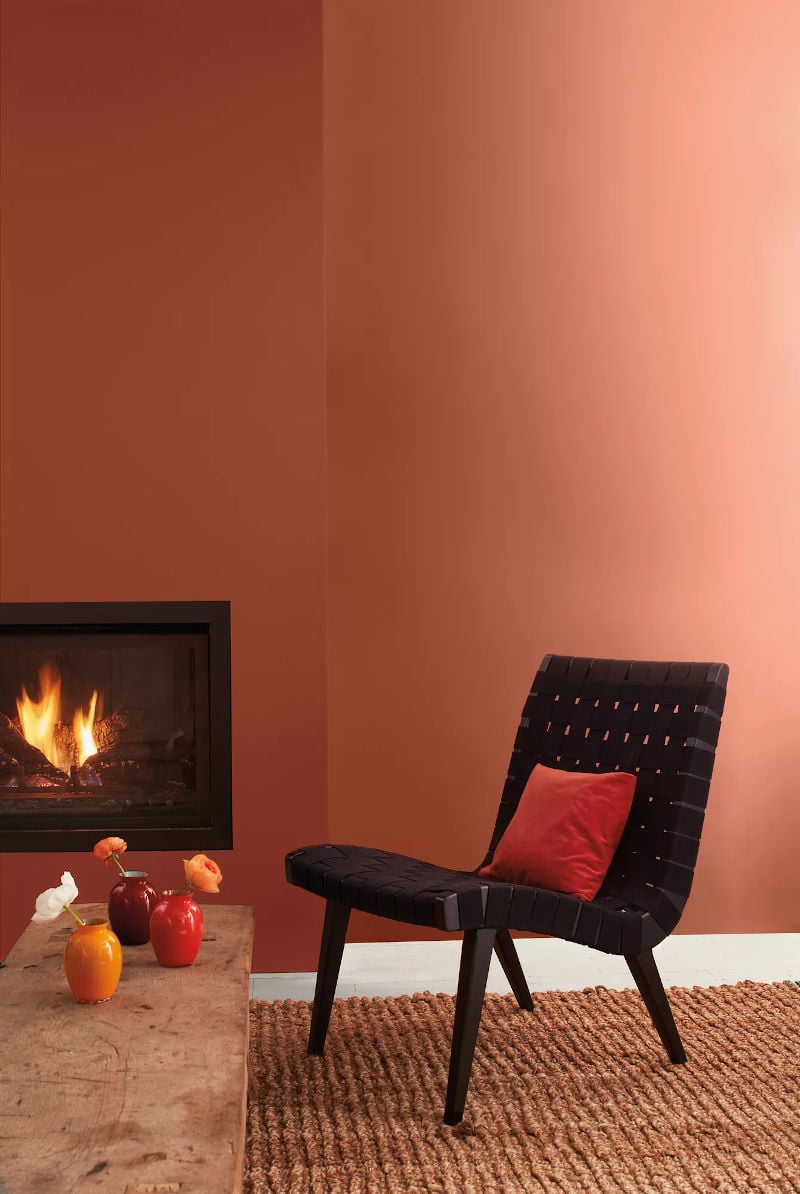 benjamin moore cinnamon colour painted walls with fireplace and chair
