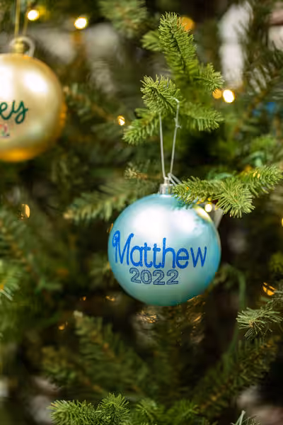 teal custom christmas bulb with words Matthew 2022 on it