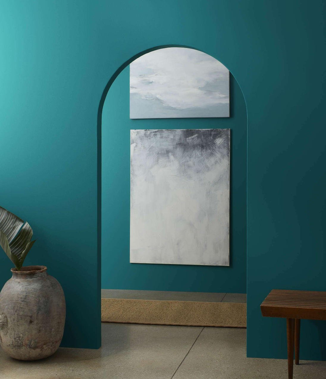 wall with arched doorway painted in benjamin moore north sea green color