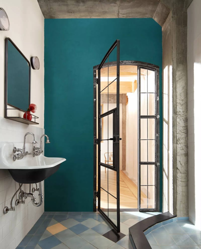 bathroom with one wall painted in benjamin moore north sea green colour