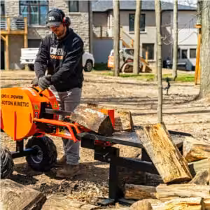 man operating the dk2 ops240 log splitter